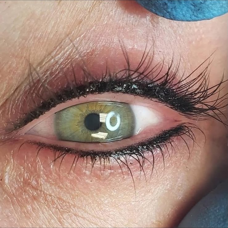 Permanent eyeliner drawn on the upper and lower lids